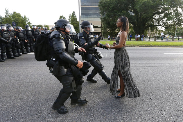 A demonstrator protesting the shooting death of Alton Sterling is detained by law enforcement near the headquarters of the Baton Rouge Police Department in Baton Rouge, Louisiana, U.S. July 9, 2016. REUTERS/Jonathan Bachman TPX IMAGES OF THE DAY